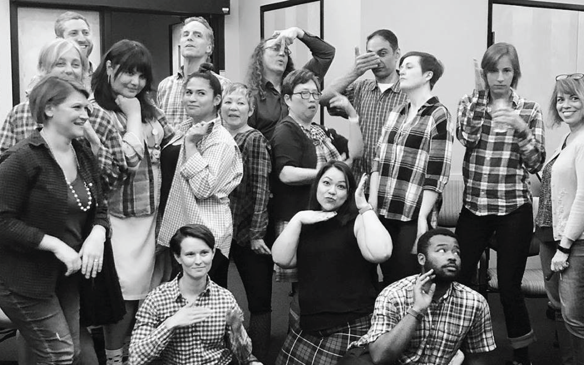 Photo caption: Meyer staff strike a pose wearing flannel, plaid and funny socks in commemoration of departing CEO Doug Stamm.