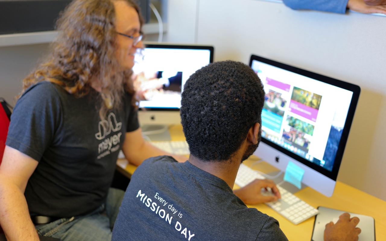 Grant Kruger, software engineer, and Darion Jones, social media specialist, adding the finishing touches to Meyer's new website.