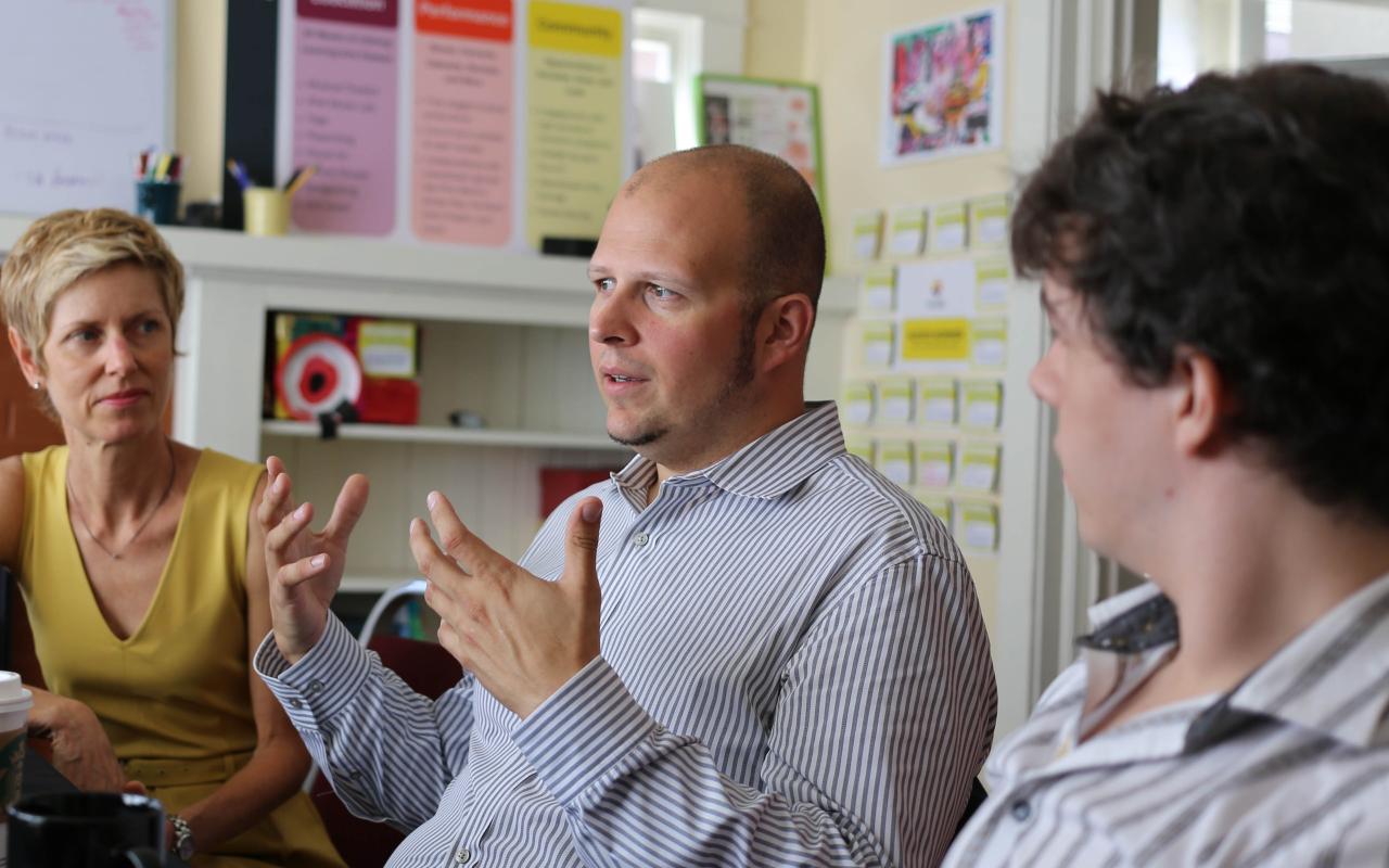 Photographed are two board members of PHAME Academy alongside Stephen Marc Beaudoin, Executive Director