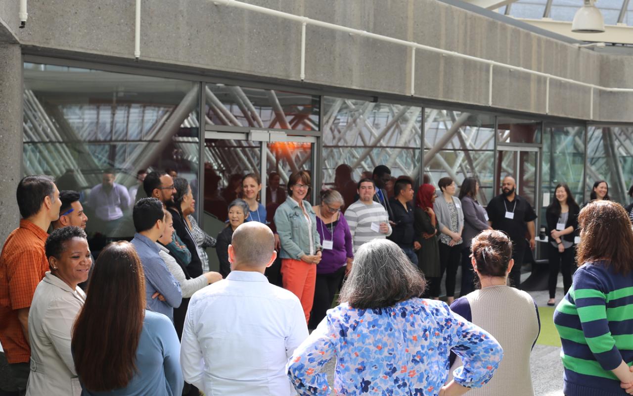 Participants in Meyer's leadership and learning collaborative gather in a circle
