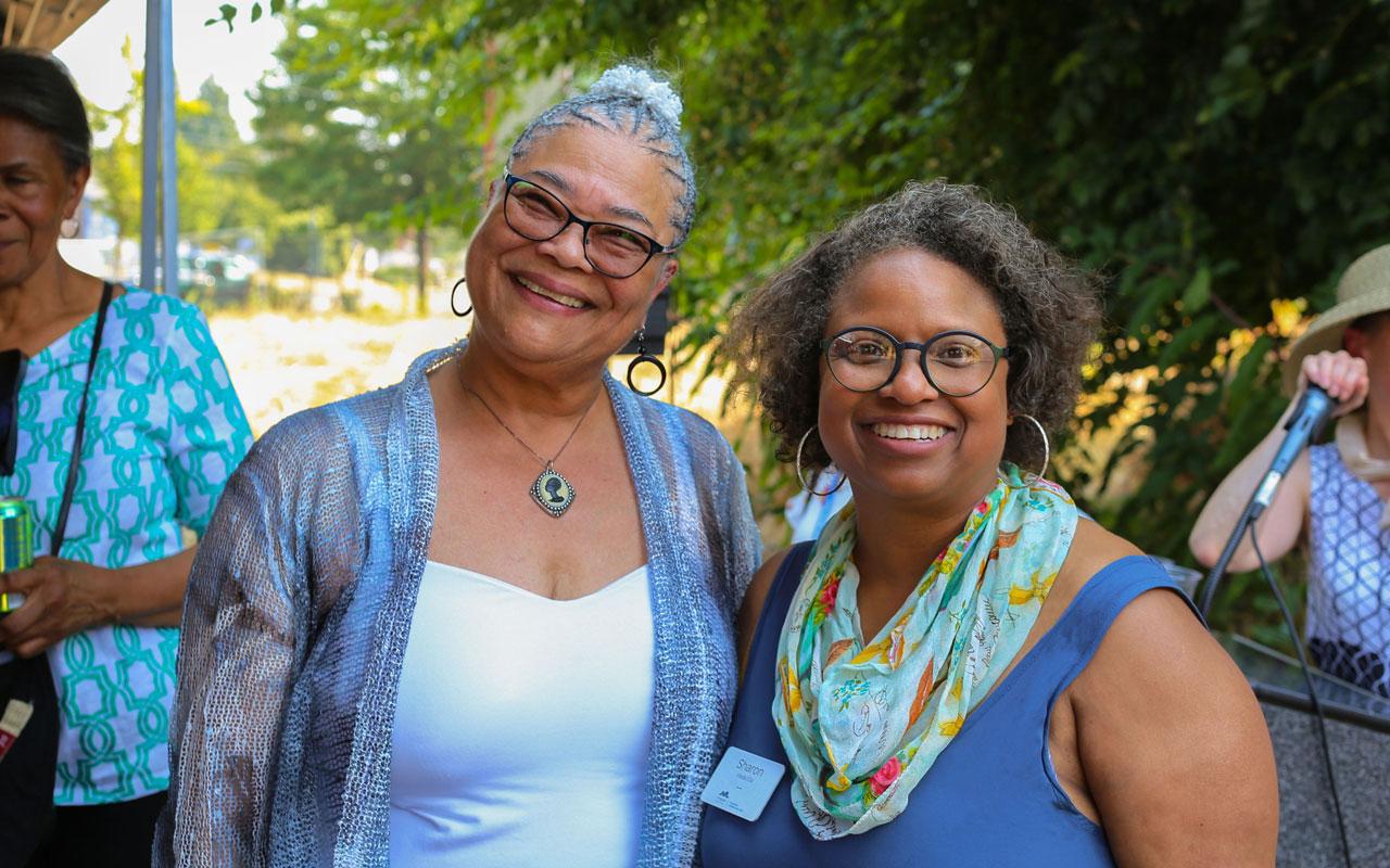 Hon. Charlotte B. Rutherford and Sharon Wade Ellis smile for the camera