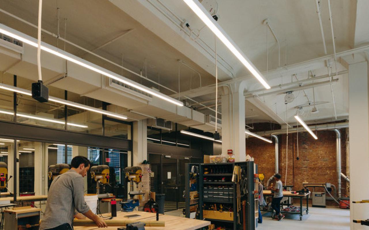 A man works in The Making Center at The New School.