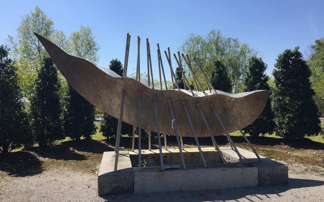 his sculpture represents the longboats that took captives from the shores of Africa to the slave ships.