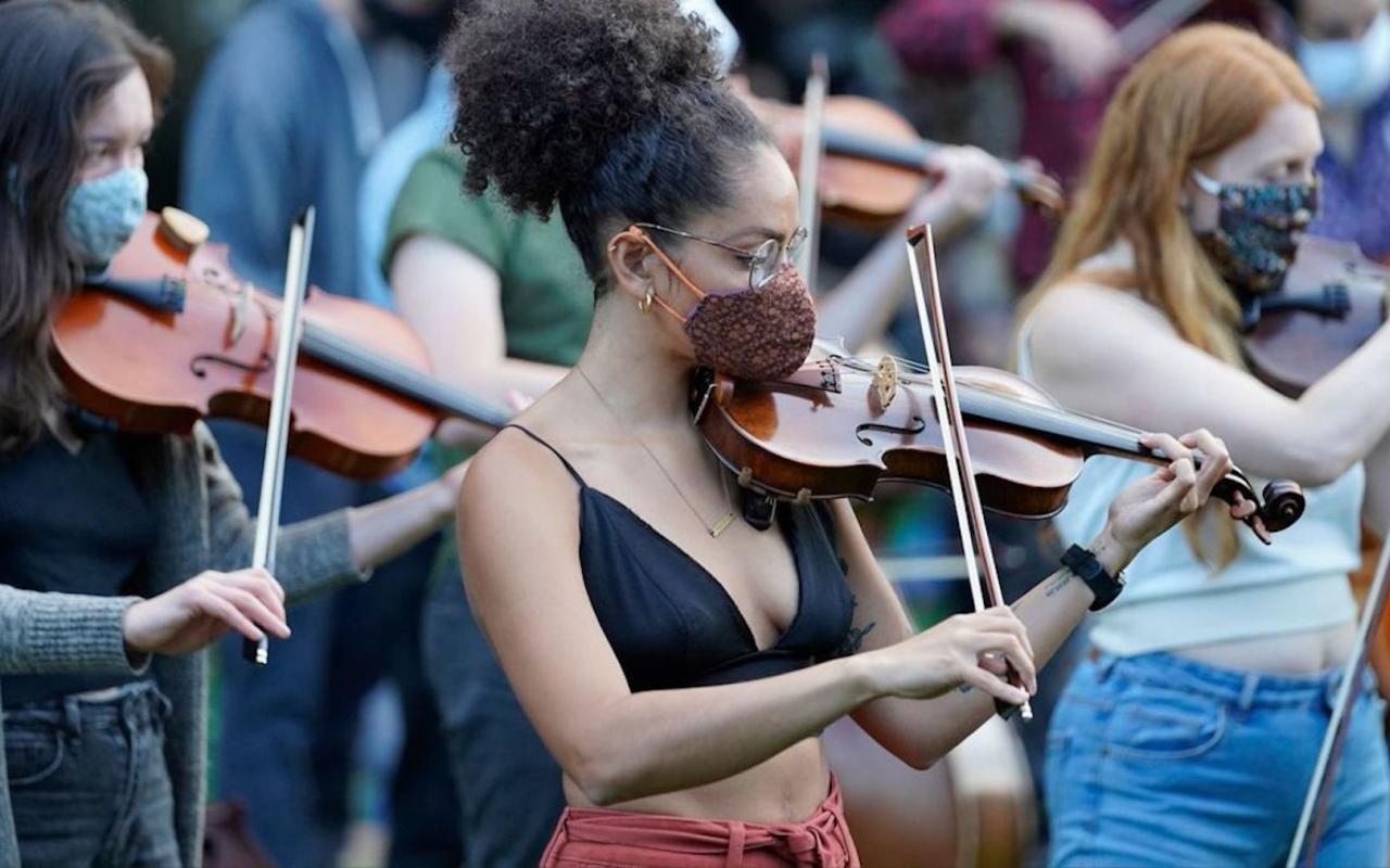 Violinists play at a Portland vigil in 2020 honoring the life of Elijah McClain.