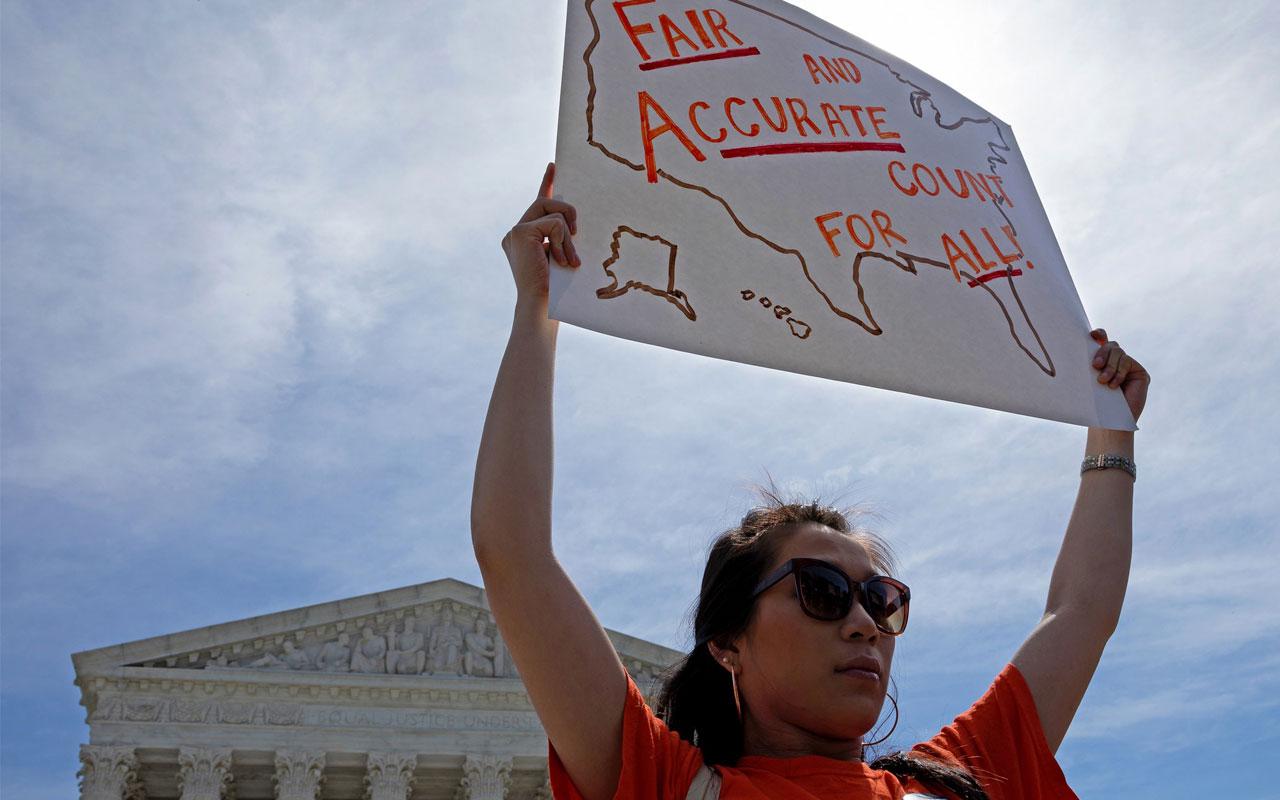 Photo source: A woman protesting the citizenship question outside the Supreme Court in April.CreditCreditAurora Samperio/NurPhoto via Getty Images (NYTimes) 