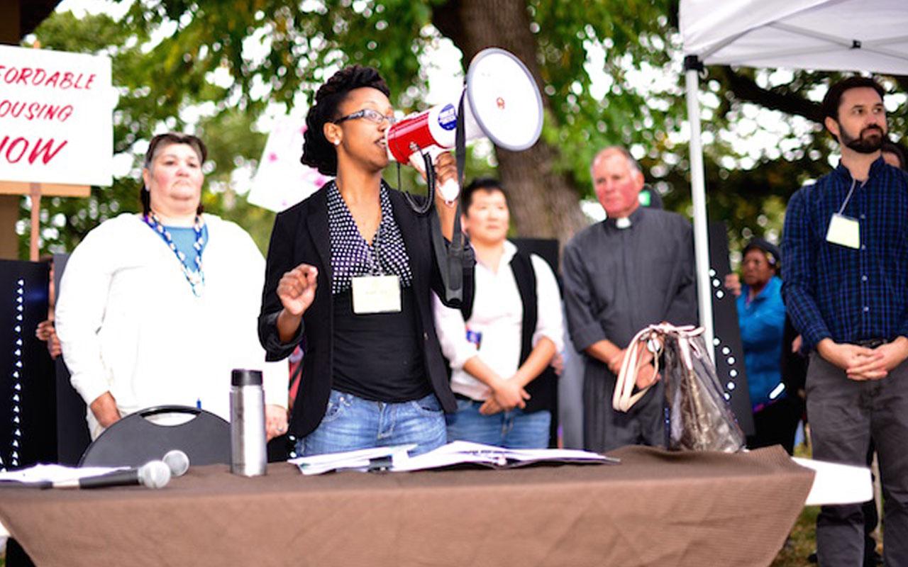 Katrina Holland, executive director of Community Alliance of Tenants, speaks at a 2016 rally for tenants’ rights. Behind her, from left to right, are Jeri Jimenez, D. Pei Wu, Pastor Mark Knutson and Justin Buri.