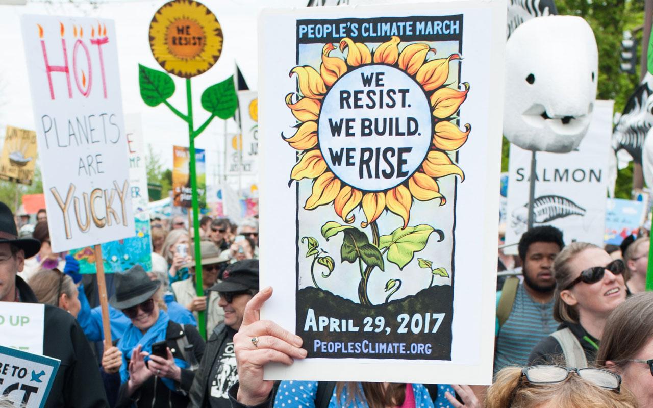 A crowd of people marching during the 2017 Portland People's Climate Movement March.